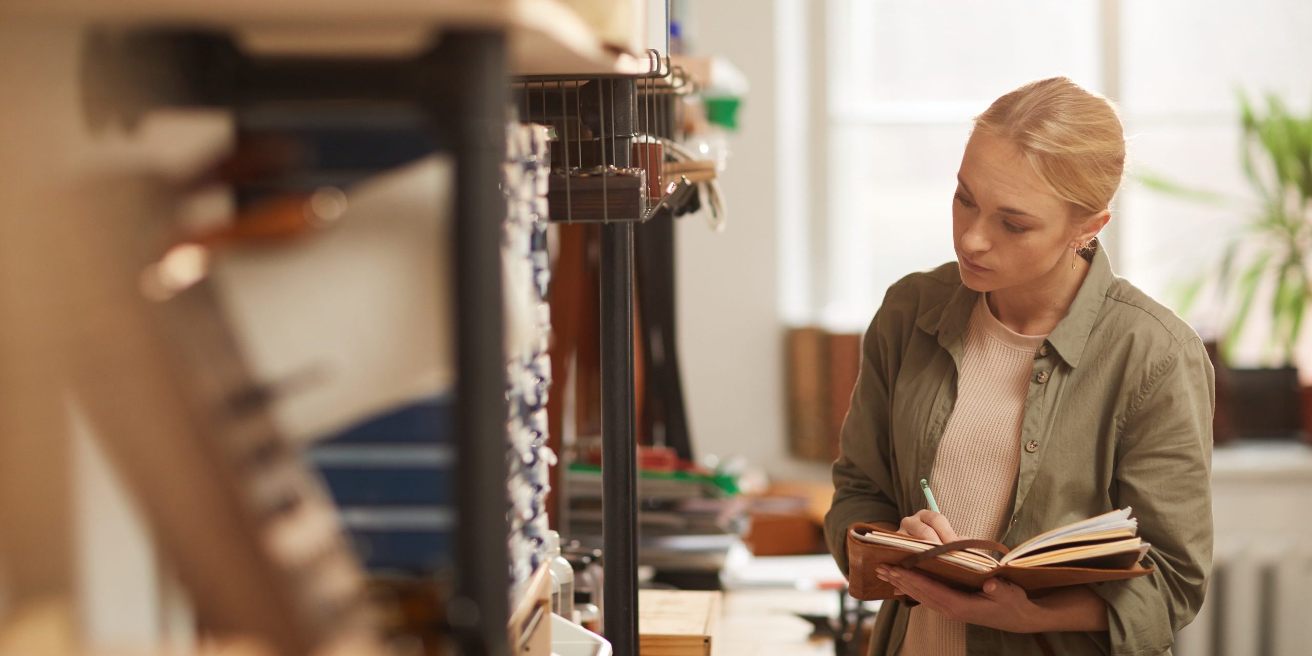 Woman Checking Quantity Of Materials